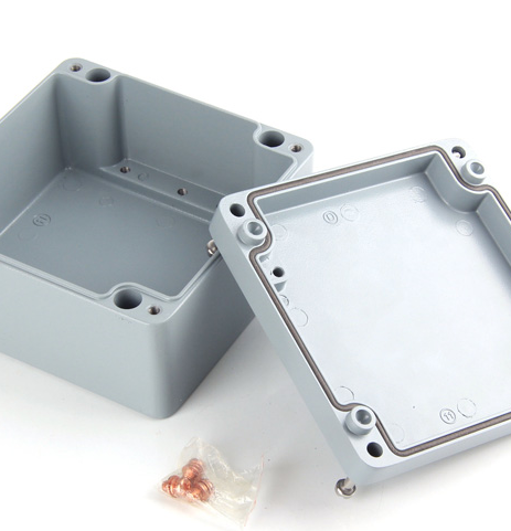 How do I use a metal cable connector with a waterproof junction box?